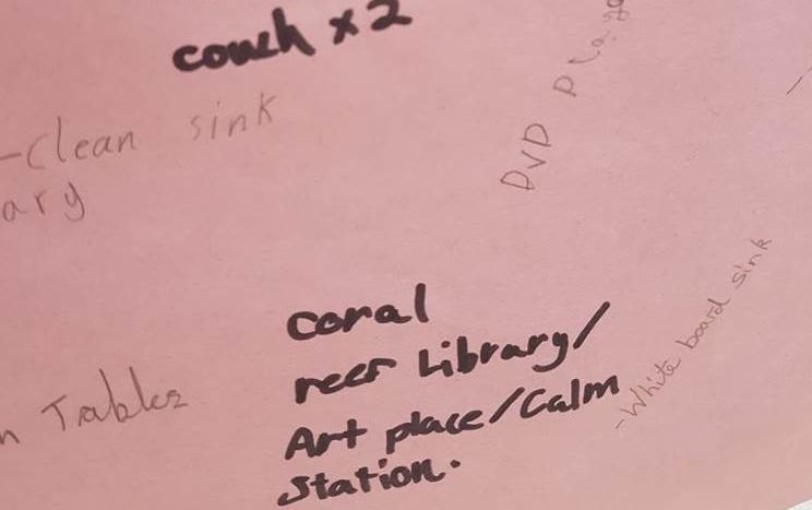 couch x2, DVD player, clean sink, coral reef library, art place, calm station, white board sink