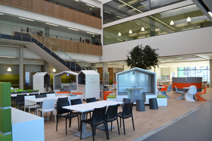 The social space has dining tables and cafe style seating