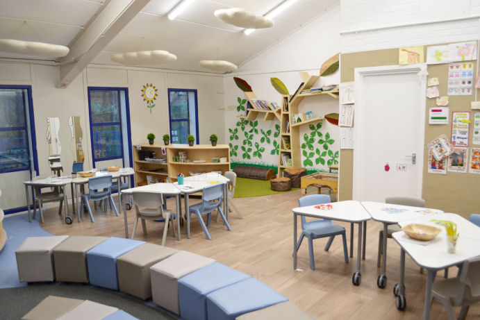 a library tree shelf unit, flexible tables and comfy seating