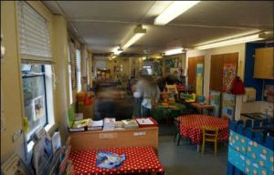 the classroom was dark and cluttered with bright coloured decoration