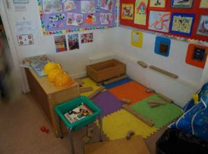 A construction corner with rubber matting on the floor
