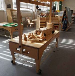 Sand and water play area, wooden toy cars and track