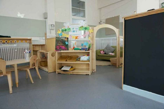 A chalk board wall and cozy corner