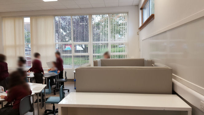 a standing desk and comfy booth