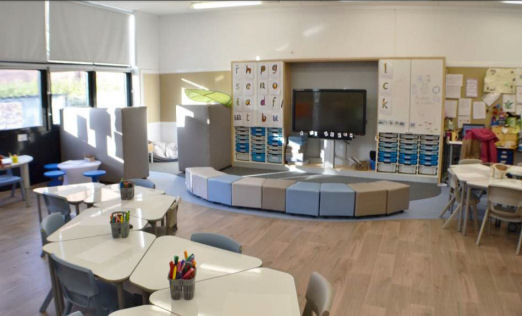 a teaching wall and comfy seats