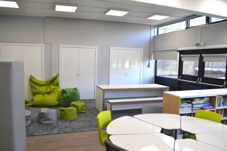 Different seating areas for various activities, beanbags, workbench and a group table