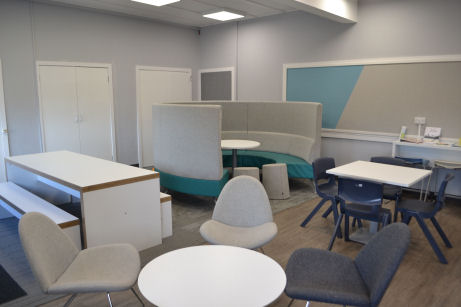 cafe style seating, a workbench, a square table and a circular booth