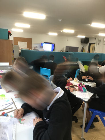 primary seven children doing work in the classroom