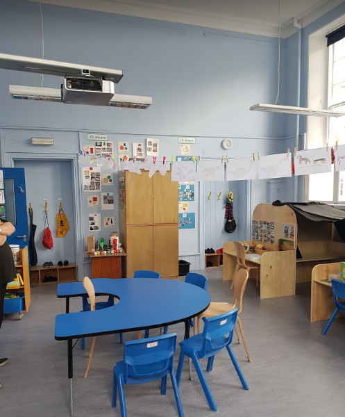 a U shaped teaching table and two workstations
