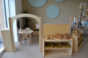 storage is at child height, the activity areas like this home corner are partitioned from the main space and accessed through a little arch