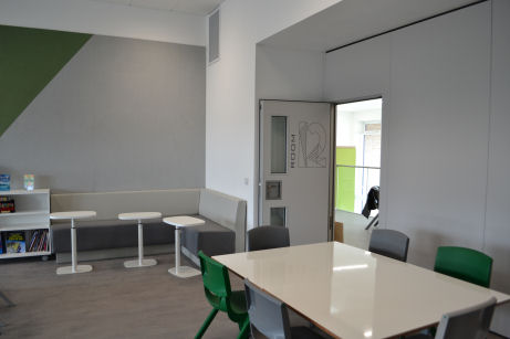 a large table and an L shaped sofa give variety and choice