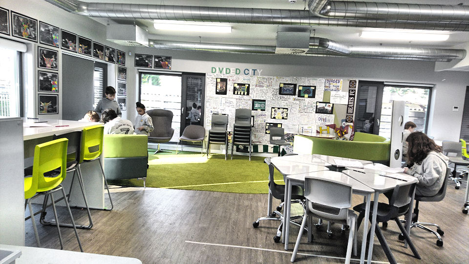 four children gather in the comfy area