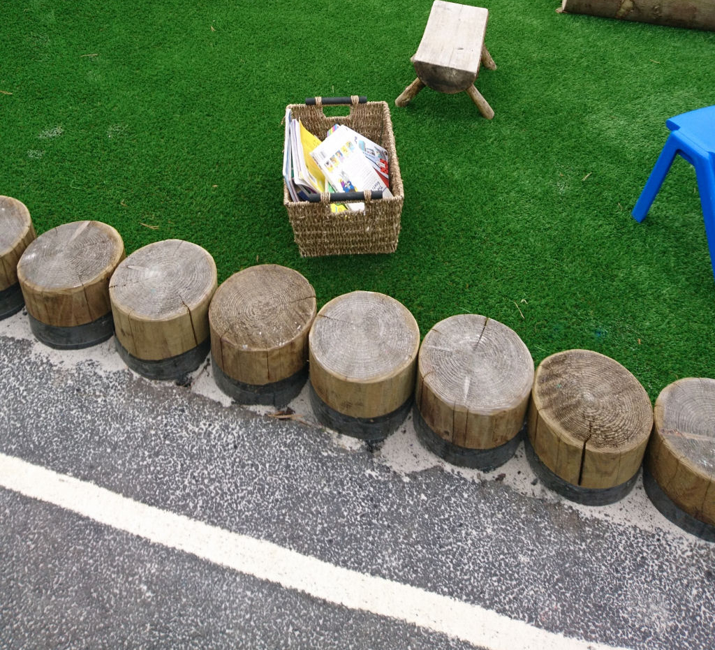 a row of logs as a border and seating