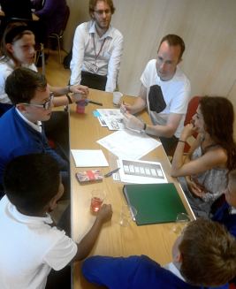 children talk to a professional about their design