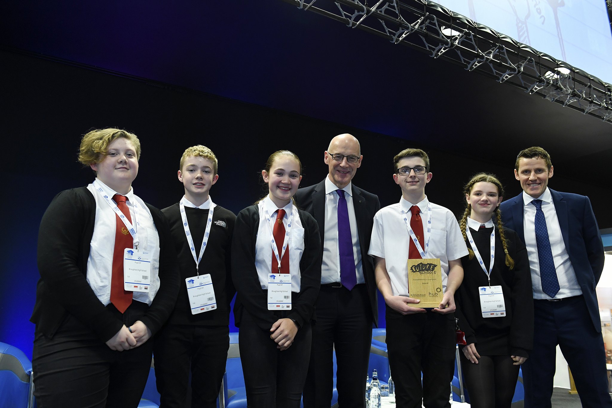 five young people from Broughton High School pose with their trophy alongside Depute First Minister John Swinney, and Richard Park from HUB South East