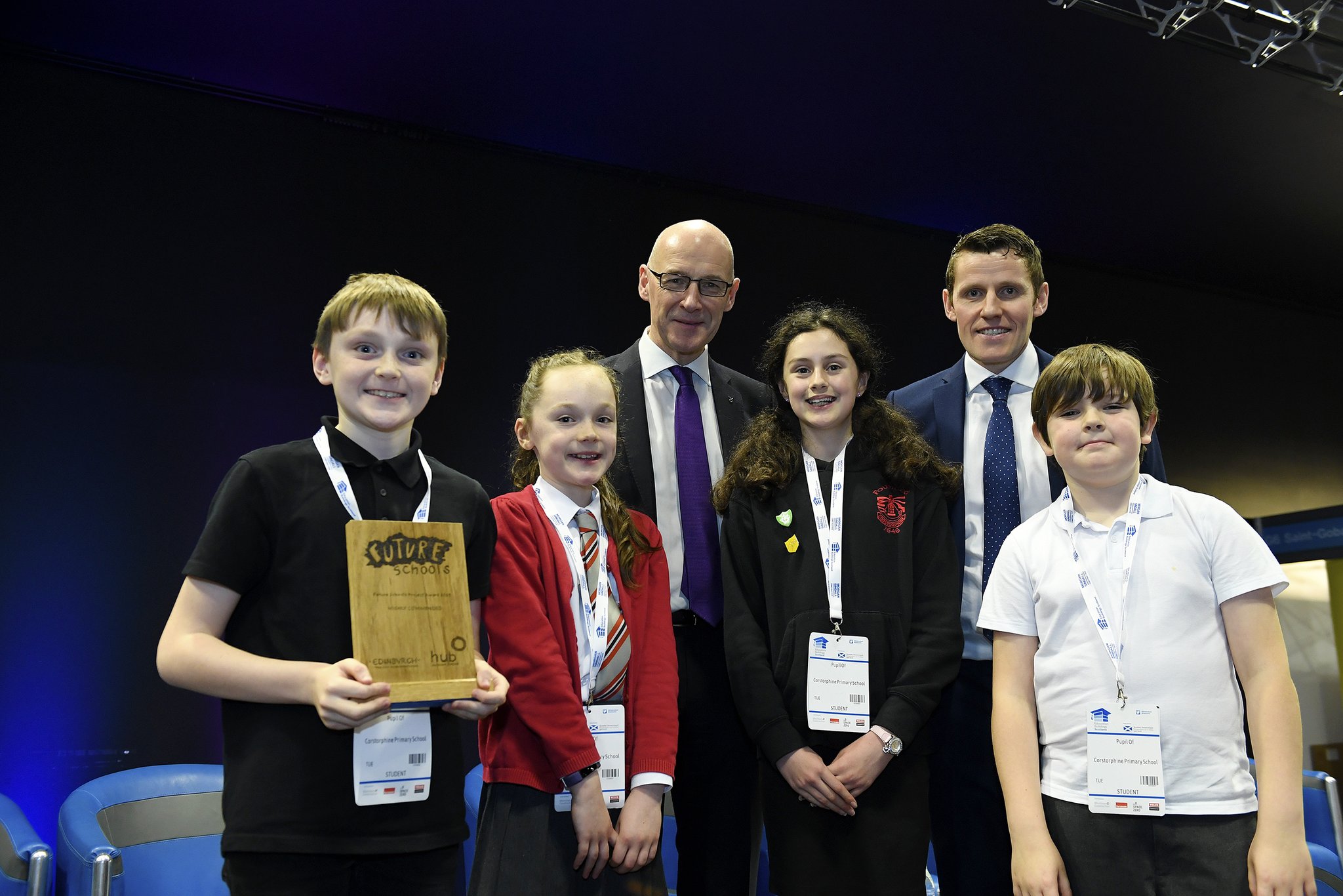 Four children from Corstorphine primary pose with their trophy alongside Depute First Minister John Swinney, and Richard Park from HUB South East
