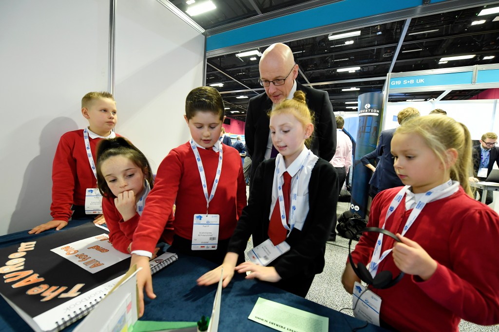 learners from St John Vianney's Primary talk to the depute first minister about their design