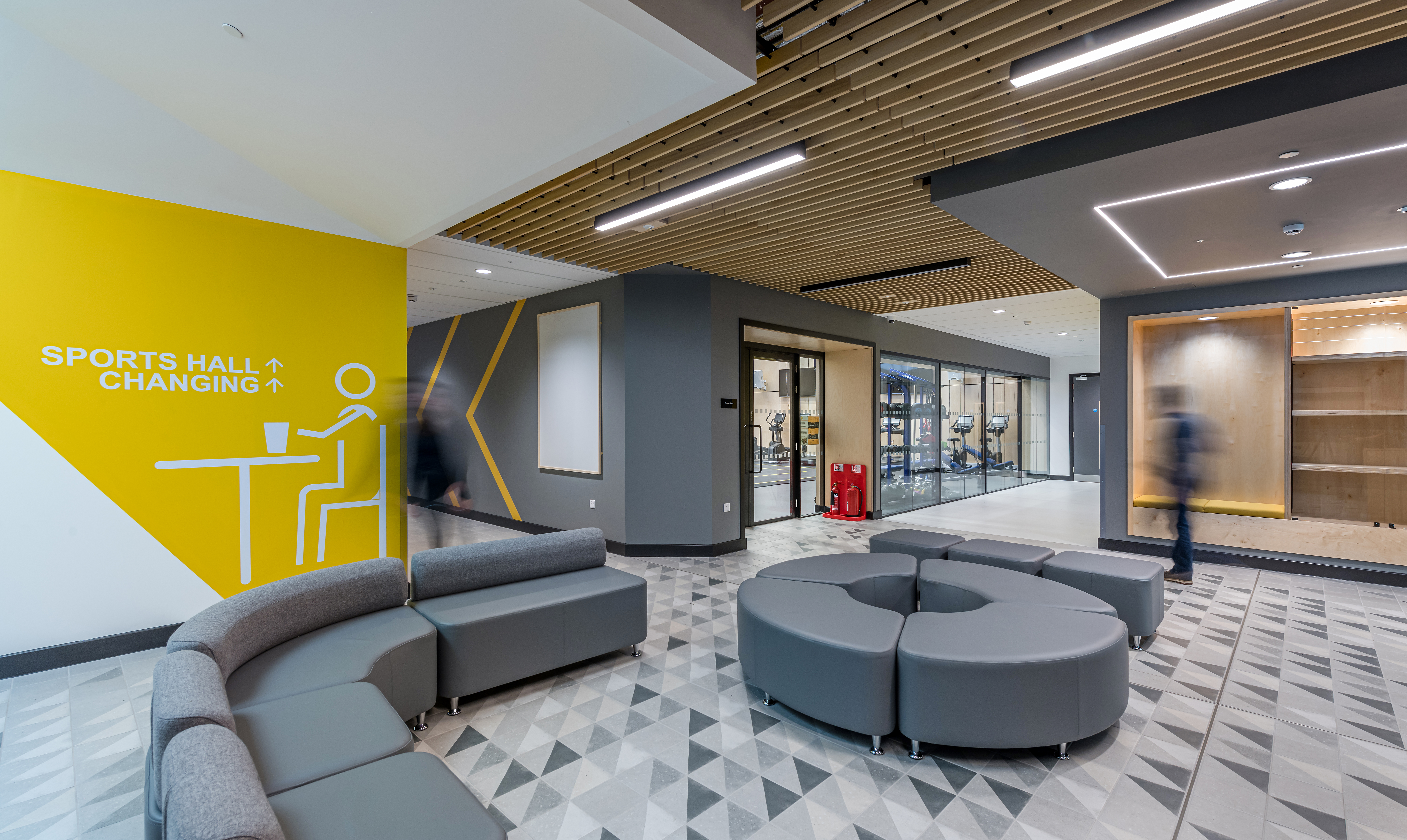 Waiting area with grey soft seating that can be moved to create different layouts