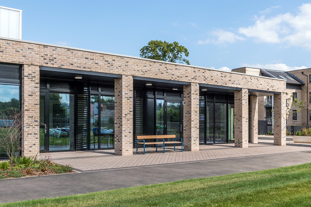 outside of the community rooms with glazed wall