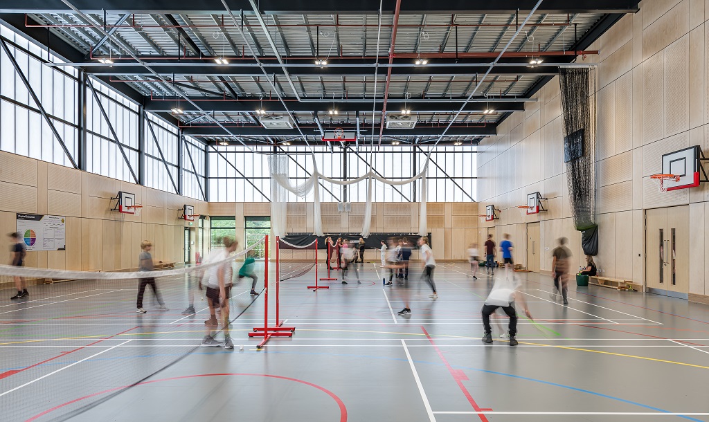students playing badminton in the sports hall