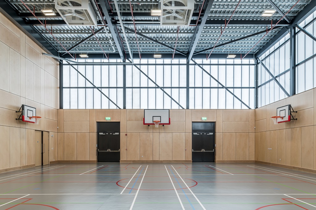 The gym hall showing three basketball hoops on three walls