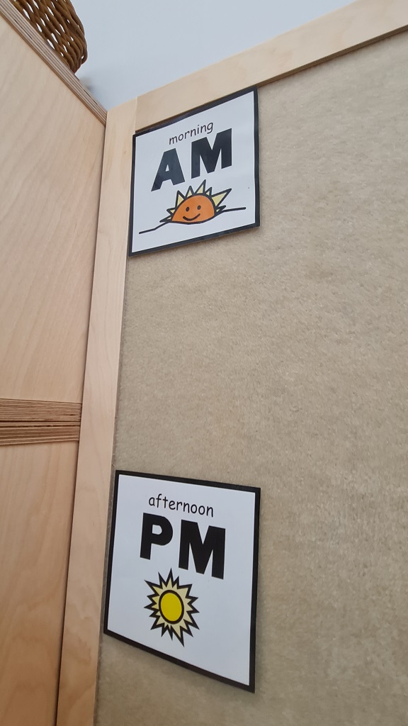 A close up of the velcro pinboard with two pictures stuck on