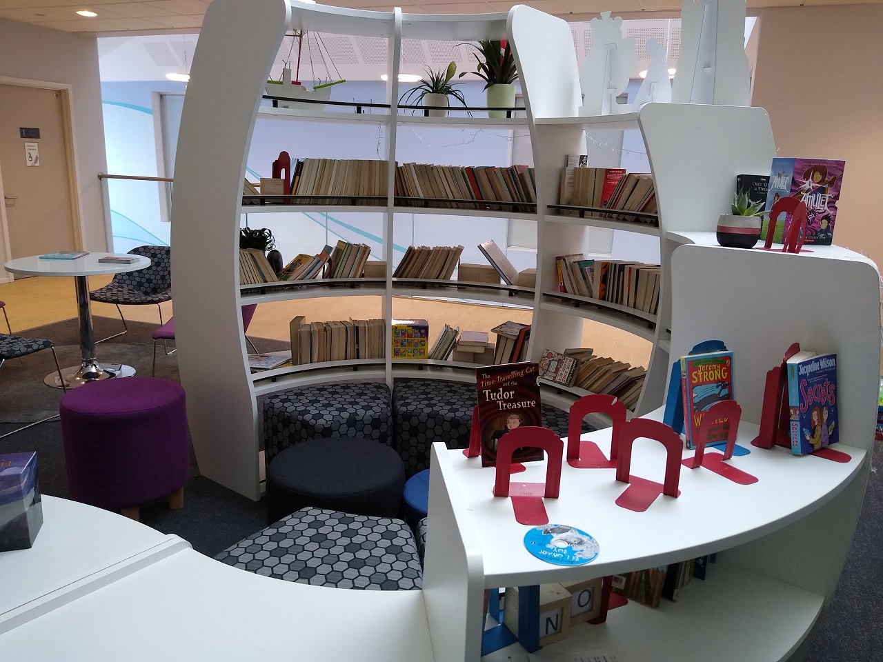 seating inside the curved bookshelves